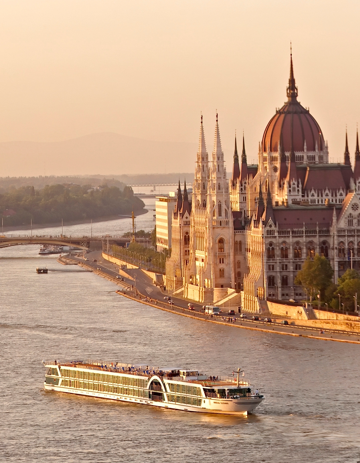 River cruise sailing along the Danube River through historic European cities